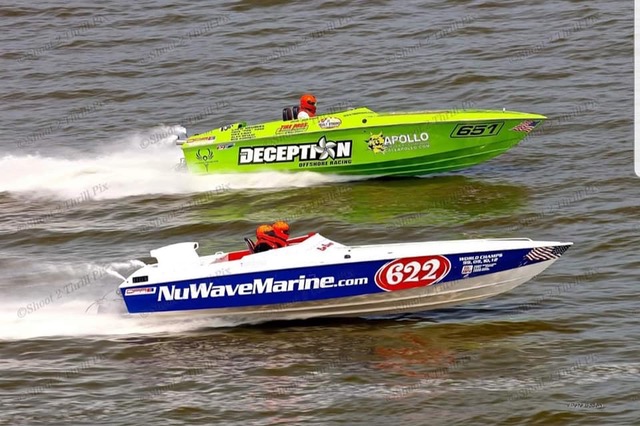 Two speedboats racing across the water.